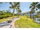 Home boasts a landscaped backyard with pond views and privacy at 5951 Bay Dr, Gulfport, FL 33707