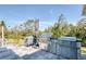 Backyard features an outdoor kitchen with a grill at 5951 Bay Dr, Gulfport, FL 33707
