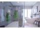 Bright bathroom showcasing a sleek shower, freestanding tub, and stylish accents at 5951 Bay Dr, Gulfport, FL 33707