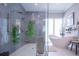 Spa-like bathroom with a walk-in shower and freestanding tub at 5951 Bay Dr, Gulfport, FL 33707