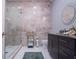 Modern bathroom with walk-in shower, granite countertops, and tiled floors at 5951 Bay Dr, Gulfport, FL 33707