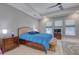 Bright bedroom featuring marble floors, ceiling fan, and three large windows allowing lots of natural light at 5951 Bay Dr, Gulfport, FL 33707