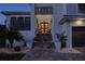 Inviting front entrance featuring a vibrant door, decorative wreaths, and comfortable seating area at 5951 Bay Dr, Gulfport, FL 33707