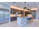 Open kitchen with stainless steel appliances, marble countertops, and a center island with seating at 5951 Bay Dr, Gulfport, FL 33707