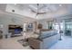 Relaxing living room featuring sectional sofa and large TV at 5951 Bay Dr, Gulfport, FL 33707