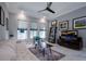 Bright and airy living room with large windows and comfortable seating at 5951 Bay Dr, Gulfport, FL 33707