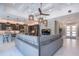 Open concept living space with views to the kitchen, and white tile flooring at 5951 Bay Dr, Gulfport, FL 33707