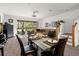 Dining area with glass table and access to backyard at 660 Spring Lake Cir, Tarpon Springs, FL 34688