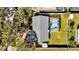 Aerial view of the house featuring a pool in a screened enclosure and a well maintained yard at 7801 17Th N Way, St Petersburg, FL 33702