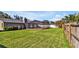 Large backyard featuring screen enclosed pool and well-maintained lawn at 7801 17Th N Way, St Petersburg, FL 33702
