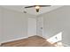 A bedroom featuring wood-look flooring, neutral paint and closet with bi-fold doors at 7801 17Th N Way, St Petersburg, FL 33702