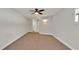 Bright bedroom featuring ceiling fan and carpet flooring at 7801 17Th N Way, St Petersburg, FL 33702