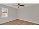 Bright bedroom featuring a large window and wood flooring at 7801 17Th N Way, St Petersburg, FL 33702