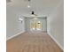 A light-filled bonus room offers neutral carpet and access to a pool and patio through french doors at 7801 17Th N Way, St Petersburg, FL 33702