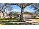 A charming single-story home offers mature landscaping, a long driveway, and an attached two-car garage at 7801 17Th N Way, St Petersburg, FL 33702