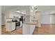 An eat-in kitchen offers stainless steel appliances, bright white cabinetry, and wood-look flooring at 7801 17Th N Way, St Petersburg, FL 33702