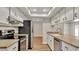 Updated kitchen with white cabinets and stainless steel appliances at 7801 17Th N Way, St Petersburg, FL 33702