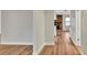 Bright living room featuring hardwood floors and a view into the combined dining and kitchen area at 7801 17Th N Way, St Petersburg, FL 33702