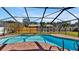 Inviting kidney-shaped pool with screened enclosure at 7801 17Th N Way, St Petersburg, FL 33702