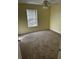 Spacious bedroom with carpeted flooring, ceiling fan, and window blinds at 806 Lake Haven Sq # 105, Brandon, FL 33511