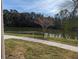 View overlooking a community lake with a walking path at 806 Lake Haven Sq # 105, Brandon, FL 33511