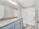 Bathroom with granite countertop and a single vanity at 1192 Multiflora Loop, Lutz, FL 33558