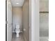 Small bathroom with toilet and shower at 1192 Multiflora Loop, Lutz, FL 33558