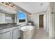 Large bathroom with double vanity, walk-in closet and garden tub at 1192 Multiflora Loop, Lutz, FL 33558
