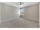 Bright bedroom featuring a ceiling fan and carpet at 1192 Multiflora Loop, Lutz, FL 33558