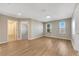 Spacious bedroom with hardwood floors and access to bathroom at 1192 Multiflora Loop, Lutz, FL 33558