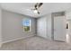 Bedroom with carpet flooring and double door closet at 1192 Multiflora Loop, Lutz, FL 33558