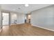 Upstairs bedroom with hardwood floors and laundry access at 1192 Multiflora Loop, Lutz, FL 33558