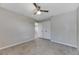Spacious bedroom with carpeted floor and double doors at 1192 Multiflora Loop, Lutz, FL 33558