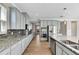 Spacious kitchen with gray cabinets and granite countertops at 1192 Multiflora Loop, Lutz, FL 33558