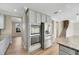 Stainless steel appliances and gray cabinets in kitchen at 1192 Multiflora Loop, Lutz, FL 33558
