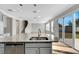 Kitchen island with granite and a double sink, open to Gathering room at 1192 Multiflora Loop, Lutz, FL 33558