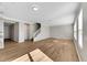 Spacious living room with hardwood floors and staircase at 1192 Multiflora Loop, Lutz, FL 33558