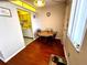 Small kitchen with a dining area, microwave and cabinets at 1235 S Highland Ave # 2-308, Clearwater, FL 33756