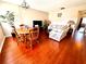 Living room with a dining area, hardwood floors, and ample natural light at 1235 S Highland Ave # 2-308, Clearwater, FL 33756