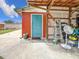 Outdoor storage with teal door and lattice walls at 1514 Sadlon Ave, Clearwater, FL 33756