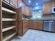 Well-equipped kitchen with ample wood cabinetry and pull-out shelves at 1534 W Del Webb Blvd, Sun City Center, FL 33573