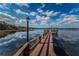 Charming wooden dock extending over the lake with scenic views at 2268 Lake Arbor Blvd, Clearwater, FL 33763