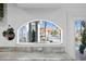 Kitchen with arched window offering water and pool views at 259 6Th N Ave, Tierra Verde, FL 33715