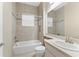 Clean bathroom with a bathtub, toilet and a vanity with sink at 30280 Southernwood Ct, Wesley Chapel, FL 33543