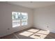Unfurnished bedroom with large window and new flooring at 3430 Sarto Ln, Rotonda West, FL 33947