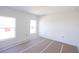 Unfurnished bedroom with two windows and wall-to-wall carpet at 3430 Sarto Ln, Rotonda West, FL 33947