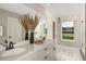 Elegant bathroom with dual sinks, quartz countertops, and a large mirror at 3457 Timber Crossing Ave, Brandon, FL 33511