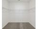 Spacious walk-in closet with ample shelving for optimal organization and storage solutions at 3952 Big Sky Dr, Spring Hill, FL 34604