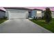 Charming single-Gathering home featuring a spacious driveway, attached garage, and well-maintained landscaping at 3952 Big Sky Dr, Spring Hill, FL 34604