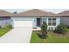 Charming single-story home with a well-manicured lawn and a two-car garage at 3952 Big Sky Dr, Spring Hill, FL 34604